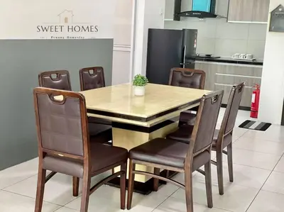a dining room table and chairs in a kitchen at CozySuite3R2B#5mintoPenangBridge in Perai