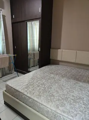 a bed in a room with a large mattress at HomeStay Pulai in Ipoh