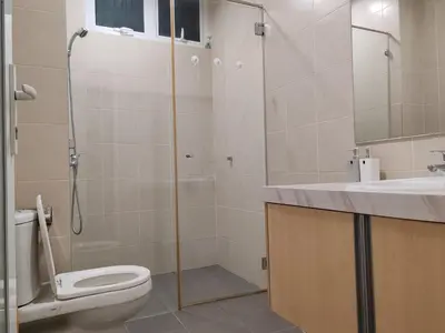 a bathroom with a shower and a toilet and a sink at Invincible Seaview Vacation Condo 3R3B 8Pax in Bayan Lepas