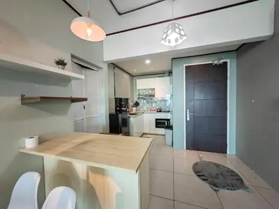 a kitchen with a wooden counter in a room at Modern Comfy Suite Room-9Pax in Perai