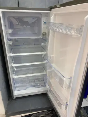 an empty refrigerator with its door open and itsartmentsearch at HOMESTAY ANGGUN SAFIYYA in Bayan Lepas