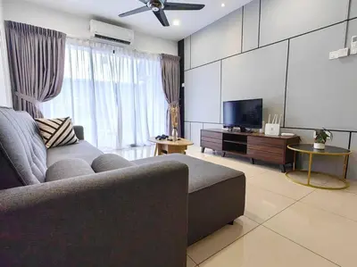 a living room with a couch and a flat screen tv at 6-7Pax 3BR Waterpark Condo W Ps4 Near Ipoh Town in Kampong Pinji