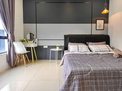 a bedroom with a bed and a table and chairs at 6-7Pax 3BR Waterpark Condo W Ps4 Near Ipoh Town in Kampong Pinji