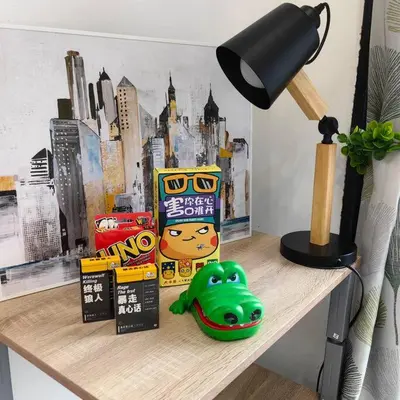 a desk with a lamp and a toy on a table at 15-19Pax SemiD Near Highwy W/Pool Table&Karaoke in Ipoh