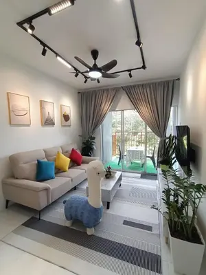 a living room with a couch and a table at Dream 5 @ Emerald avenue in Brinchang