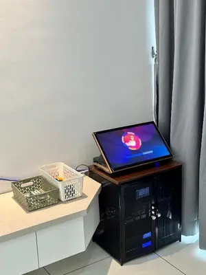 a laptop computer sitting on top of a table at Peak Homestay@Ipoh Perak Malaysia 10-14Pax 5R/6B in Lahat