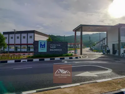 a gas station with a sign on the side of a road at HAZZ Homestay Kulim in Kulim