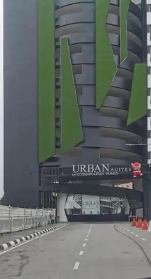 a building with a sign on the side of it at Urban Suites - Dolphin's Home in Jelutong