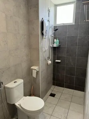 a bathroom with a toilet and a shower at Jc Homestay in Ipoh