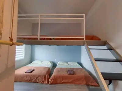 two bunk beds in a small room with at Evening/Night de Ville-50pax Private Pool BBQ in Ipoh