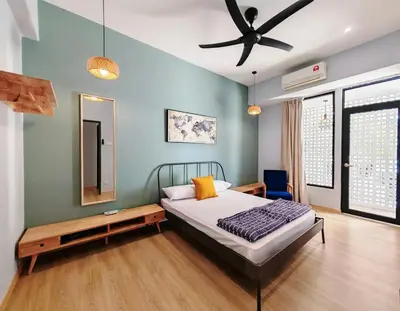 a bedroom with a bed and a ceiling fan at 35 BeachHouse Batu Ferringhi 7 Bedroom 7 Bathroom EV friendly in Batu Ferringhi