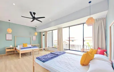 a bedroom with a large bed and a large window at 35 BeachHouse Batu Ferringhi 7 Bedroom 7 Bathroom EV friendly in Batu Ferringhi