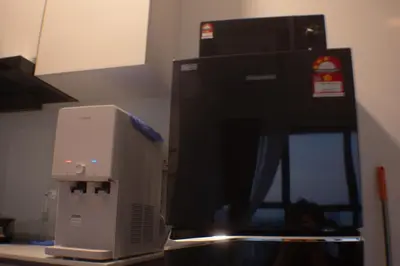 a computer monitor sitting on top of a counter at Prime Comfort Seaview with Netflix and Water Filter near Georgetown in Jelutong