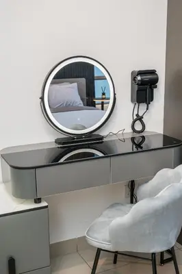 a dressing table with a mirror and a chair at Serene Modern Family Retreat(2-7 pax)&Sunrise View in Cameron Highlands