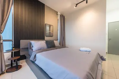 a bedroom with a large bed and a window at Serene Modern Family Retreat(2-7 pax)&Sunrise View in Cameron Highlands