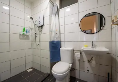 a bathroom with a toilet and a sink at Serene Modern Family Retreat(2-7 pax)&Sunrise View in Cameron Highlands