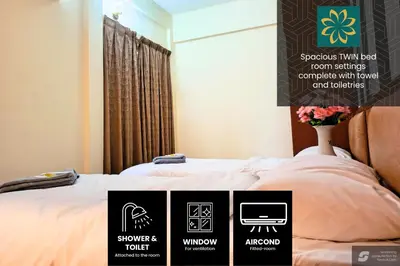a bed with four signs on the side of it at Thara Beach Resort in Pasir Bogak