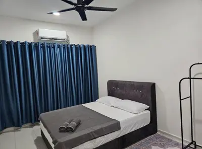 a bedroom with a bed with a ceiling fan and blue curtains at TELUK INTAN LANDED LUXURY HOMESTAY 3BEDROOM in Teluk Intan