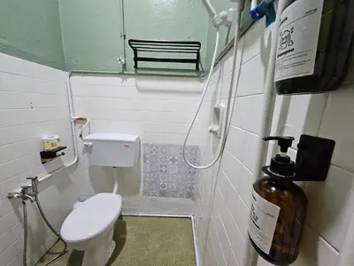 a small bathroom with a toilet and a window at 85 Boutique Hotel in Ipoh