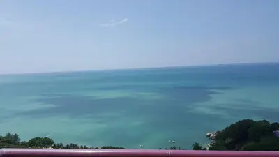a view of a body of water with trees at Batu Ferringhi Seaview Apartment in Batu Ferringhi