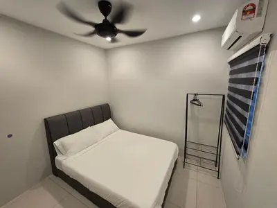 a bedroom with a bed and a ceiling fan at Manhattan Condominium - Jalan Pasir Puteh - Ipoh in Ipoh