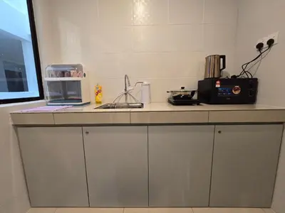 a kitchen with a counter top with a microwave at Manhattan Condominium - Jalan Pasir Puteh - Ipoh in Ipoh