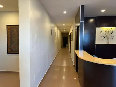 a hallway of a hospital with a long corridor at Ezzy In Hotel in Seri Manjung