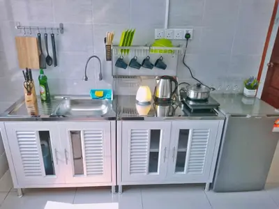 a kitchen with a sink and a counter top at Georgetown, Up to 5 Pax, 2 Bedrooms, 1 Bathroom, 1 Car Park by Star Home in George Town