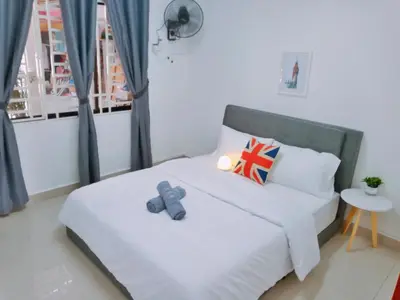 a bedroom with a bed with a blue teddy bear on it at Georgetown, Up to 5 Pax, 2 Bedrooms, 1 Bathroom, 1 Car Park by Star Home in George Town