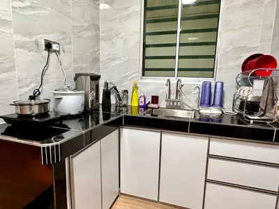 a kitchen with a sink and a counter top at Emerald Avenue Brinchang Muji style in Brinchang