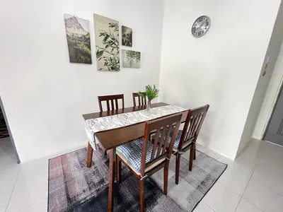 a dining room with a table and chairs at Aufa Homestay 2 at Emerald Avenue Brinchang in Brinchang