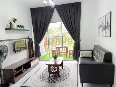 a living room with a couch and a table at Aufa Homestay 2 at Emerald Avenue Brinchang in Brinchang