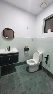 a bathroom with a toilet and a sink at AY Homestay Midtown Falim in Ipoh