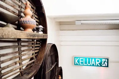 a sign that says keller on the side of a building at Sojourn Beds & Cafe in Taiping