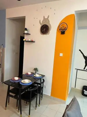 a dining room with two tables and a clock on the wall at Ws Falim in Ipoh