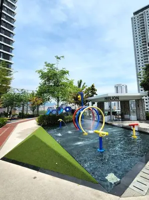 a water park with a playground in front of a building at Modern Luxe Island Suites #3BR in Jelutong
