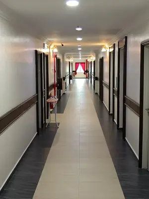 a hallway of a dressing room with a long aisle at river hotel in Simpang