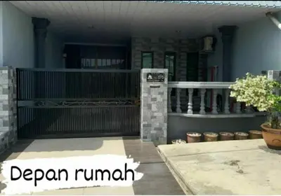 a patio with a book shelf and a plant at Homestay Mukhriz in Kulim