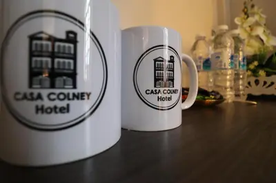 two coffee mugs sitting on top of a table at Casa Colney Hotel Ipoh in Ipoh
