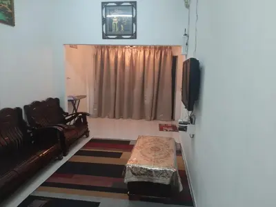 a living room with a couch and a table at DIAMOND HOMESTAY in Kuala Kangsar