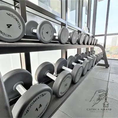 a row of dumbbells on display in a gym at Urban Suites Studio #SelfCheck-In #PrivateSpace in Jelutong