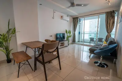 a living room with a table and chairs and a couch at Georgetown Seaview MansionOne @Penang in George Town