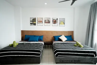 two beds sitting next to each other in a room at Georgetown Seaview MansionOne @Penang in George Town
