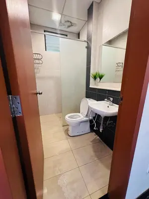a bathroom with a toilet and a sink at Adamhawa Homestay 2 Nova Cameron Highlands in Brinchang