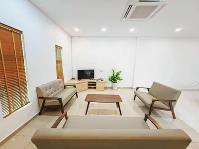 a living room with a couch and chairs and a tv at 90 Home4Stay 2storeySemi-D gurney&beach Shopping local food in Tanjung Bungah