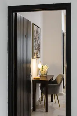 a door leading into a room with a table and a chair at 35 Home4Stay Tanjong Bungalow Wedding BBQ Near Beach restaurant in Tanjung Bungah