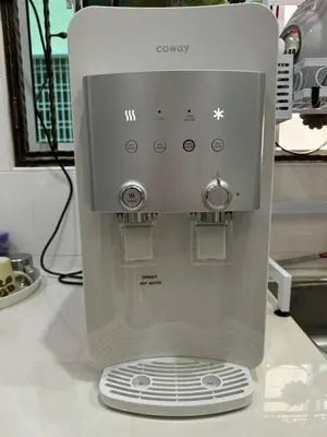 a white mixer sitting on top of a counter at Nyaman Sweet Home in Balik Pulau