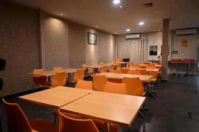 an empty classroom with tables and chairs at Hotel Jelai @ Raub, Pahang in Raub