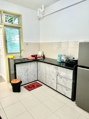 a kitchen with a sink and a counter top at Spice Arena Service Apartment in Bayan Lepas