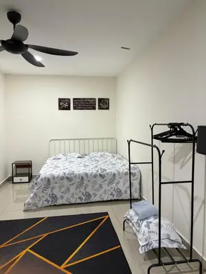 a bedroom with a bed and a ceiling fan at AFA Home KKB in Kuala Kubu Baharu